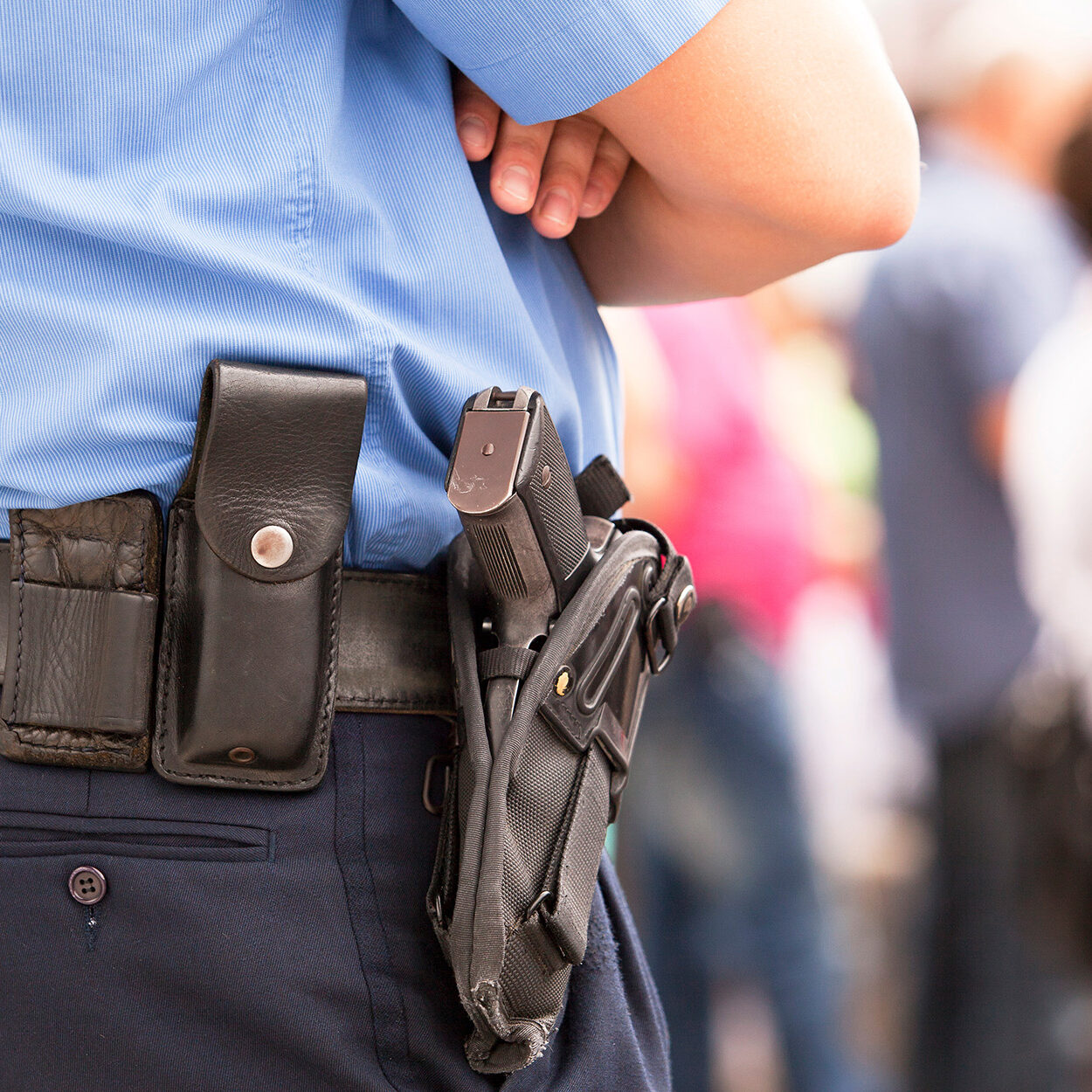 police officer with gun in holster